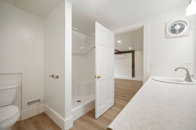 427 Haley Rd, Kittery, ME 03905 - full bath with wood finished floors, toilet, a shower, and vanity