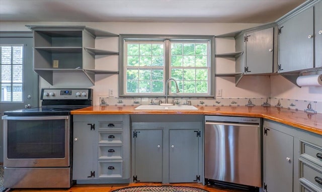 15 Feylers Corner Rd, Waldoboro, ME 04572 - kitchen featuring appliances with stainless steel finishes, open shelves, gray cabinets, and plenty of natural light