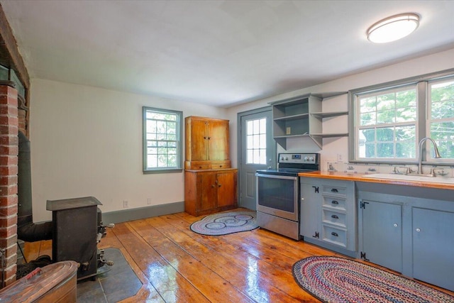 15 Feylers Corner Rd, Waldoboro, ME 04572 - kitchen featuring stainless steel electric stove, light wood-type flooring, open shelves, wooden counters, and gray cabinets