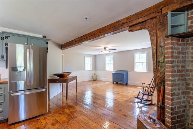 15 Feylers Corner Rd, Waldoboro, ME 04572 - kitchen with stainless steel refrigerator with ice dispenser, beamed ceiling, hardwood / wood-style flooring, ceiling fan, and arched walkways