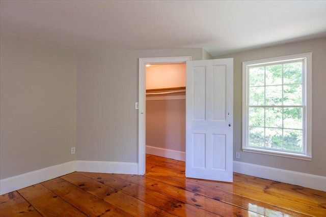 15 Feylers Corner Rd, Waldoboro, ME 04572 - unfurnished bedroom with hardwood / wood-style flooring, a closet, and a spacious closet