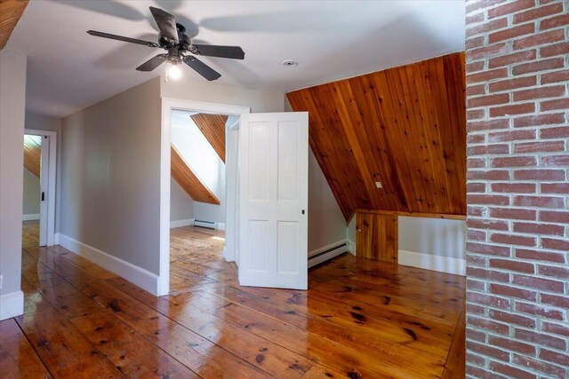 15 Feylers Corner Rd, Waldoboro, ME 04572 - additional living space featuring wood-type flooring, baseboard heating, ceiling fan, a baseboard heating unit, and vaulted ceiling