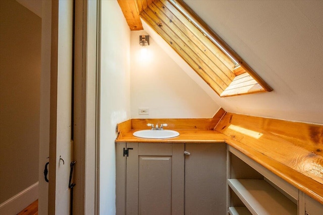 15 Feylers Corner Rd, Waldoboro, ME 04572 - bathroom with a sink and vaulted ceiling