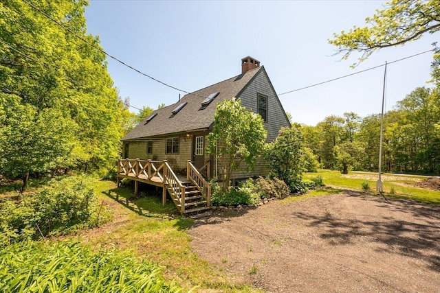 15 Feylers Corner Rd, Waldoboro, ME 04572 - back of house with a wooden deck, a shingled roof, a chimney, and stairs