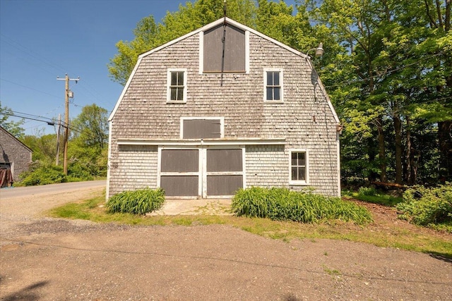 15 Feylers Corner Rd, Waldoboro, ME 04572 - view of side of home featuring a gambrel roof, a barn, and a detached garage