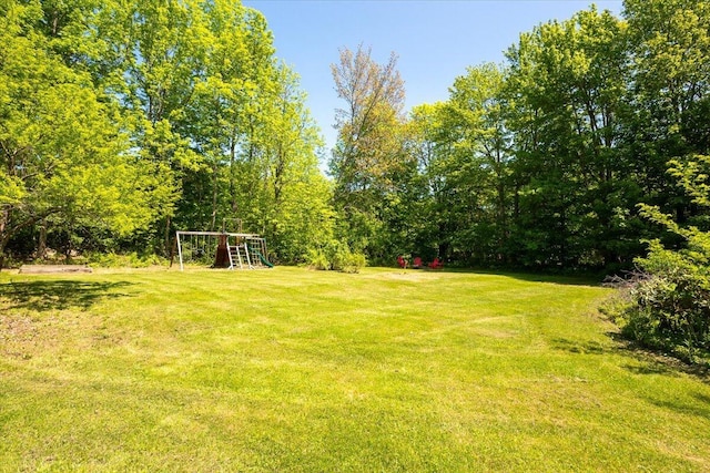 15 Feylers Corner Rd, Waldoboro, ME 04572 - view of green lawn with a playground