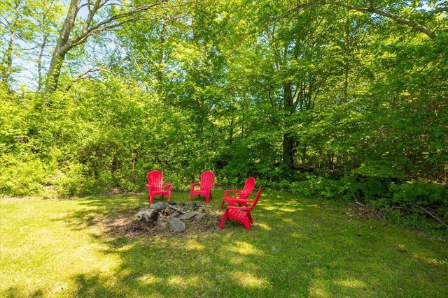 15 Feylers Corner Rd, Waldoboro, ME 04572 - view of grassy yard with an outdoor fire pit