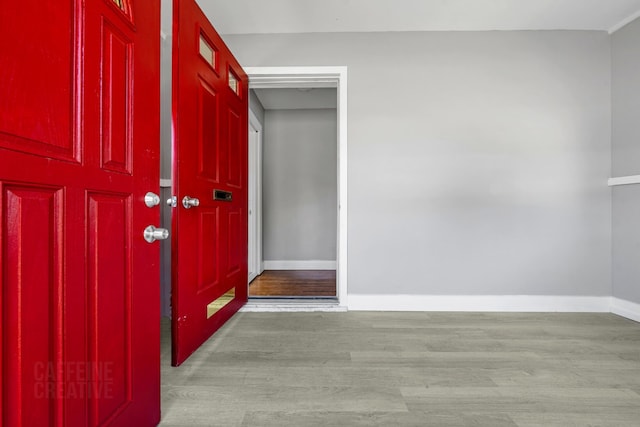 181 Webster St, Lewiston, ME 04240 - entryway featuring wood finished floors and baseboards