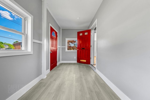 181 Webster St, Lewiston, ME 04240 - doorway to outside with wood finished floors and baseboards