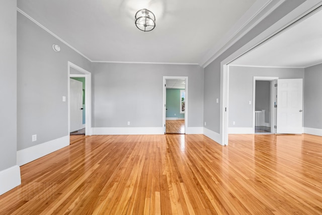 181 Webster St, Lewiston, ME 04240 - unfurnished living room with light wood finished floors, ornamental molding, and baseboards