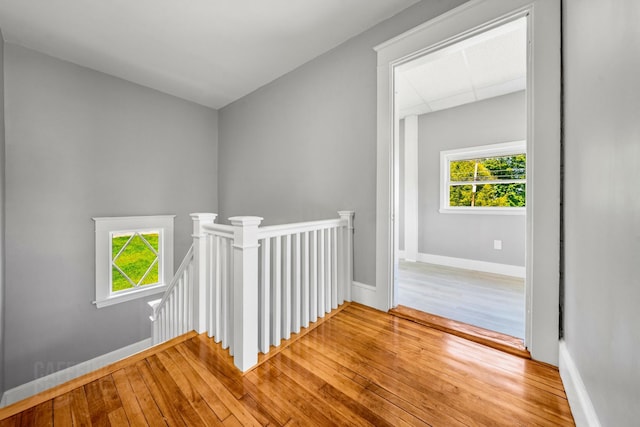 181 Webster St, Lewiston, ME 04240 - hall with an upstairs landing, plenty of natural light, hardwood / wood-style flooring, and baseboards