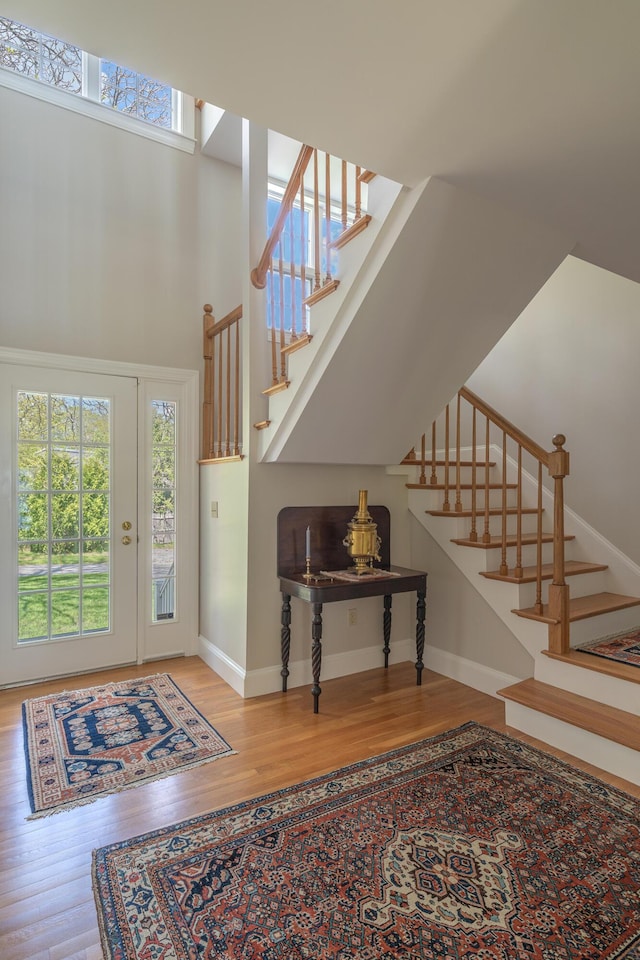 4 Roland Kimball Rd Unit 2, Freeport, ME 04032 - foyer with healthy amount of natural light, wood finished floors, and stairway