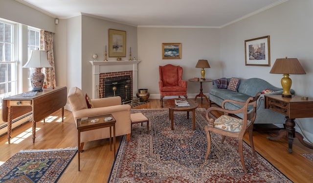 4 Roland Kimball Rd Unit 2, Freeport, ME 04032 - living room featuring light wood-style flooring, a fireplace, and crown molding