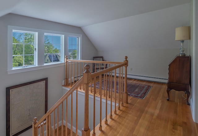 4 Roland Kimball Rd Unit 2, Freeport, ME 04032 - stairs with a baseboard heating unit, plenty of natural light, vaulted ceiling, and wood finished floors