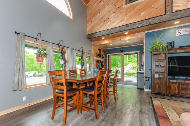 15 Doe Cir, Bingham, ME 04920 - dining area with a towering ceiling, wood finished floors, and baseboards