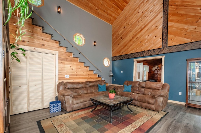 15 Doe Cir, Bingham, ME 04920 - living area featuring high vaulted ceiling, wooden ceiling, stairs, wood finished floors, and baseboards