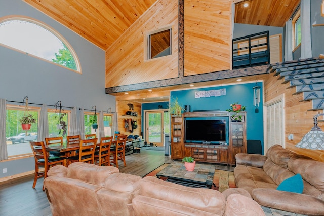 15 Doe Cir, Bingham, ME 04920 - living area featuring high vaulted ceiling, wood ceiling, wood finished floors, wood walls, and baseboards
