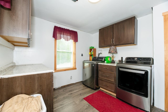 15 Doe Cir, Bingham, ME 04920 - kitchen featuring independent washer and dryer, light wood finished floors, dark brown cabinets, and light countertops