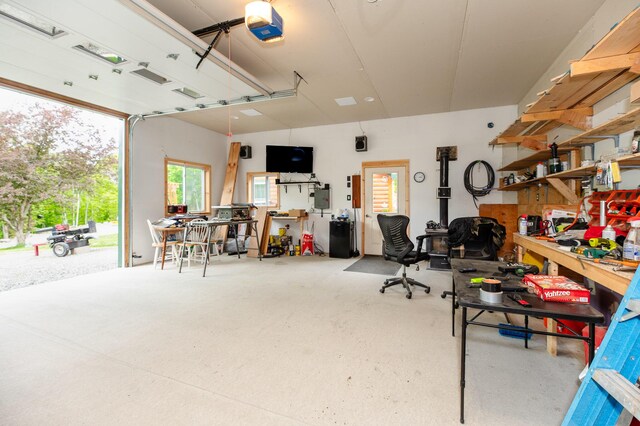 15 Doe Cir, Bingham, ME 04920 - garage featuring a workshop area and a garage door opener