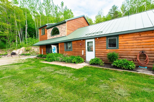 15 Doe Cir, Bingham, ME 04920 - view of front of property with a front yard, log veneer siding, metal roof, and a standing seam roof