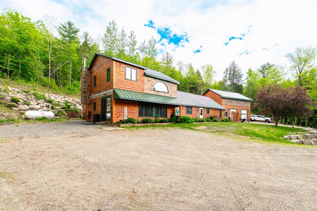 15 Doe Cir, Bingham, ME 04920 - cabin with dirt driveway, a standing seam roof, and metal roof