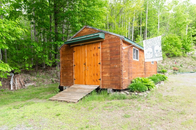 15 Doe Cir, Bingham, ME 04920 - view of outbuilding featuring a view of trees