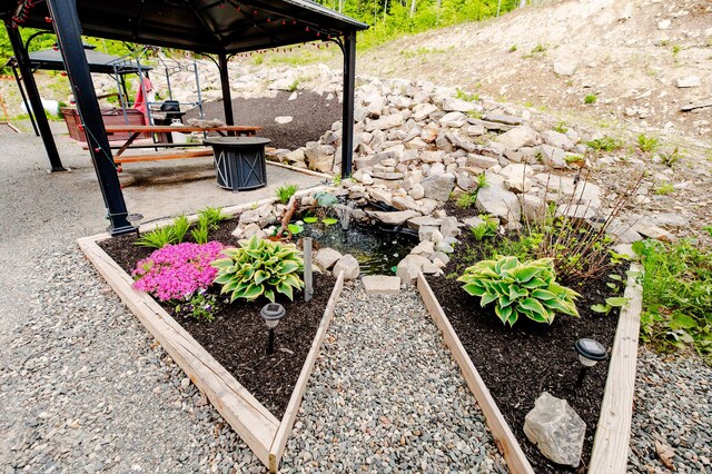 15 Doe Cir, Bingham, ME 04920 - view of yard with a gazebo and a garden pond