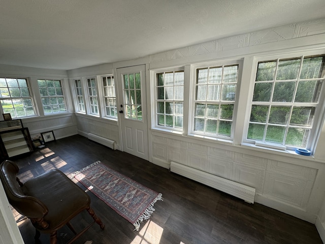 46 Arrowsic Rd, Arrowsic, ME 04530 - unfurnished sunroom with a baseboard heating unit, wood finished floors, and healthy amount of natural light