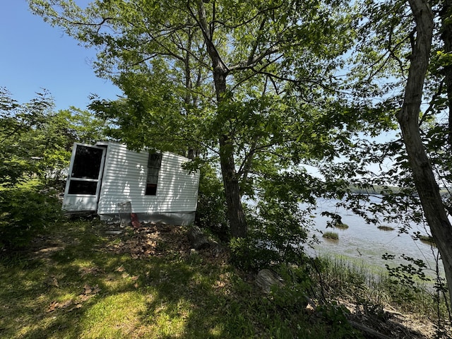 46 Arrowsic Rd, Arrowsic, ME 04530 - view of side of home with a water view and an outdoor structure
