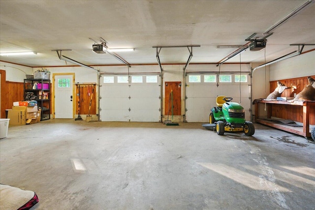 138 Lane Rd, Mechanic Falls, ME 04256 - garage featuring a garage door opener