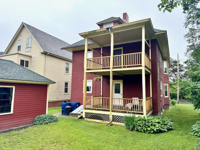 91 Washburn Ave, Portland, ME 04102 - back of house with a balcony, a yard, and a chimney