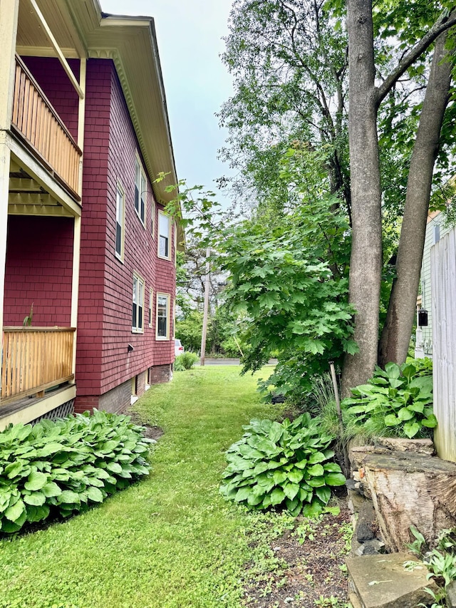 91 Washburn Ave, Portland, ME 04102 - view of grassy yard with a balcony