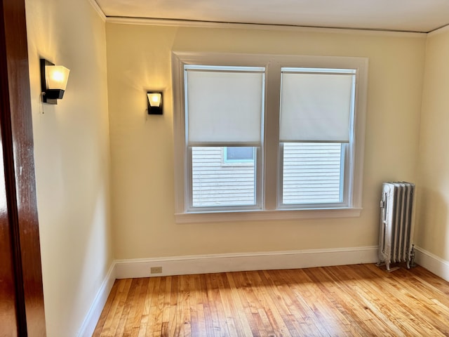 91 Washburn Ave, Portland, ME 04102 - unfurnished room with radiator, light wood-type flooring, and baseboards