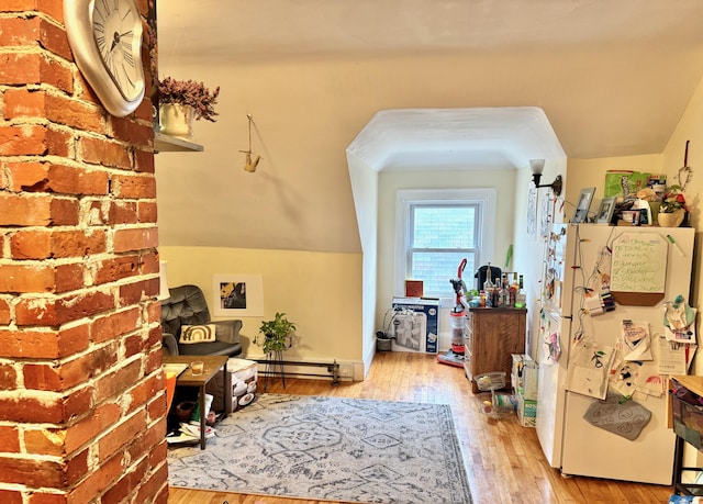 91 Washburn Ave, Portland, ME 04102 - corridor featuring wood-type flooring, a baseboard heating unit, and lofted ceiling