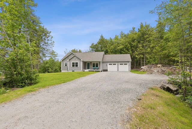 LOT10 Foye Rd, Wiscasset, ME 04578 - ranch-style home featuring gravel driveway, a garage, and a front lawn