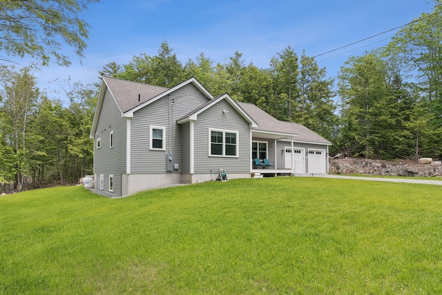 LOT10 Foye Rd, Wiscasset, ME 04578 - ranch-style home featuring a garage, a front lawn, a shingled roof, and driveway