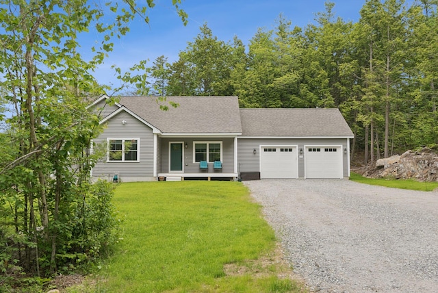 LOT10 Foye Rd, Wiscasset, ME 04578 - view of front facade featuring gravel driveway, a garage, a front lawn, a shingled roof, and a porch