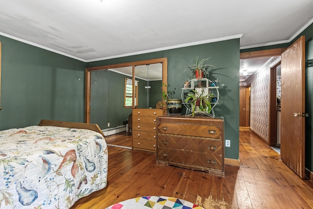 153 Shaker Rd, Gray, ME 04039 - bedroom featuring a baseboard heating unit, wood-type flooring, crown molding, and baseboards