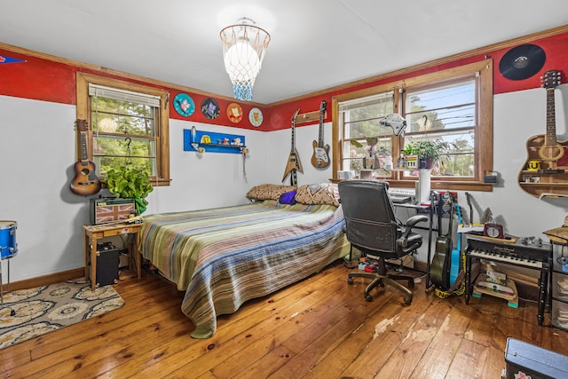 153 Shaker Rd, Gray, ME 04039 - bedroom featuring wood-type flooring and a chandelier