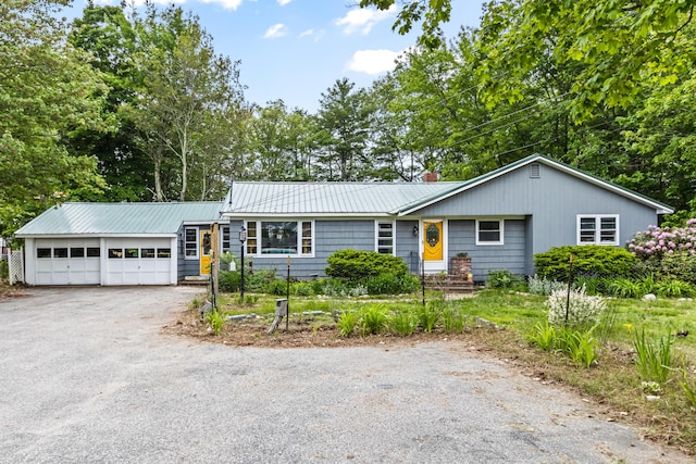 153 Shaker Rd, Gray, ME 04039 - ranch-style home featuring an attached garage, asphalt driveway, metal roof, and a chimney