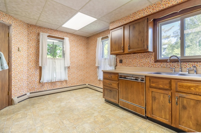 10 Joslyn St, Newport, ME 04953 - kitchen featuring dishwasher, a sink, light countertops, brown cabinetry, and a baseboard radiator
