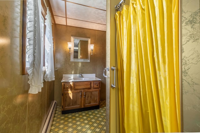 10 Joslyn St, Newport, ME 04953 - bathroom featuring a baseboard heating unit, vanity, and wallpapered walls