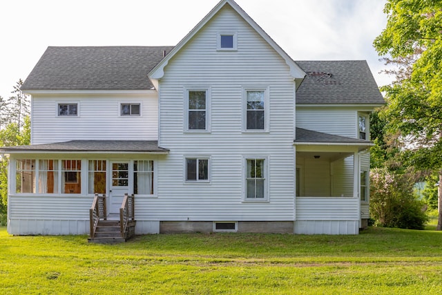 10 Joslyn St, Newport, ME 04953 - back of house with a sunroom, a shingled roof, and a lawn