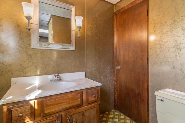 10 Joslyn St, Newport, ME 04953 - half bath featuring vanity, toilet, and wallpapered walls