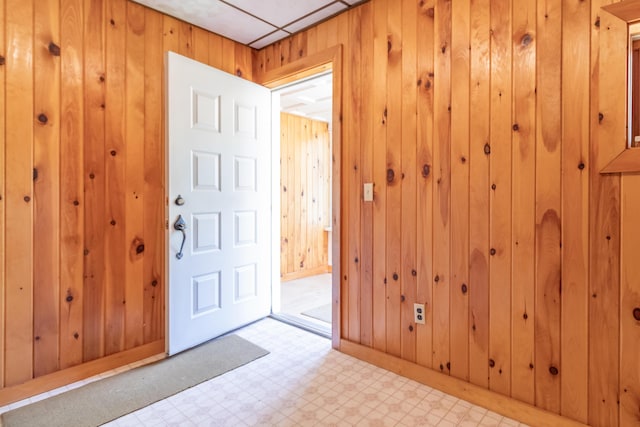 10 Joslyn St, Newport, ME 04953 - foyer featuring wood walls, light floors, and baseboards