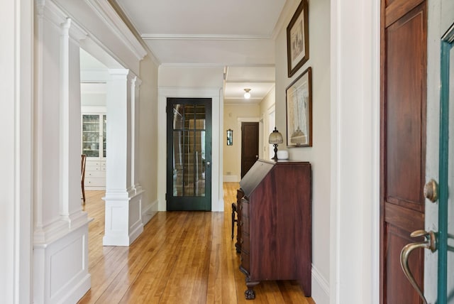 7 Carroll Ave, Auburn, ME 04210 - entrance foyer featuring decorative columns, light wood-style floors, baseboards, and crown molding