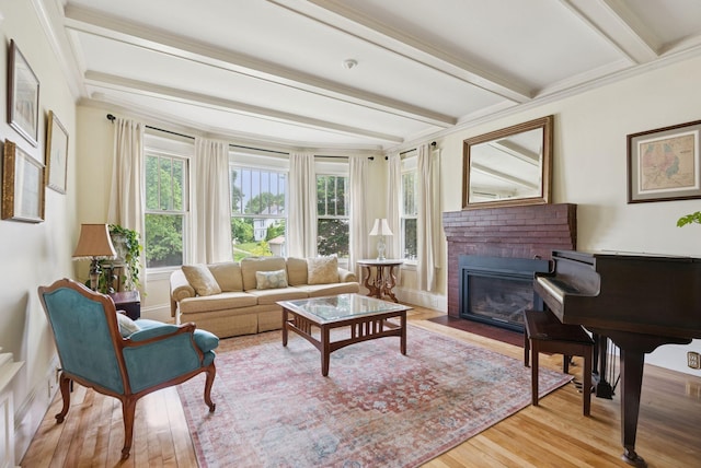 7 Carroll Ave, Auburn, ME 04210 - living room featuring beamed ceiling, a fireplace, wood finished floors, and ornamental molding