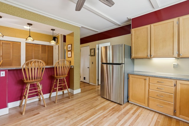 7 Carroll Ave, Auburn, ME 04210 - kitchen with freestanding refrigerator, light wood-type flooring, crown molding, decorative light fixtures, and light brown cabinetry