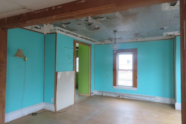 26 Walter St, Bangor, ME 04401 - empty room featuring wood finished floors and baseboards