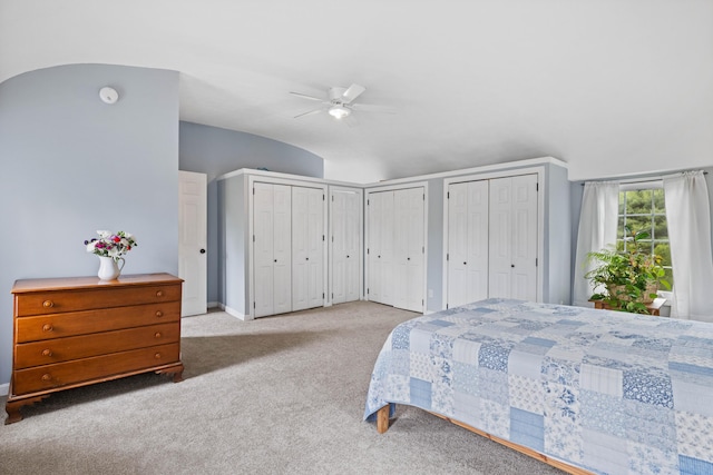 179 Alfred Rd, Kennebunk, ME 04043 - carpeted bedroom with multiple closets, vaulted ceiling, and a ceiling fan